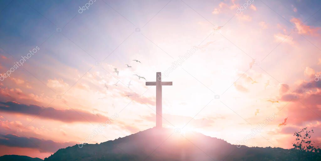 Religious concept: Silhouette cross and birds flying on  sunrise background