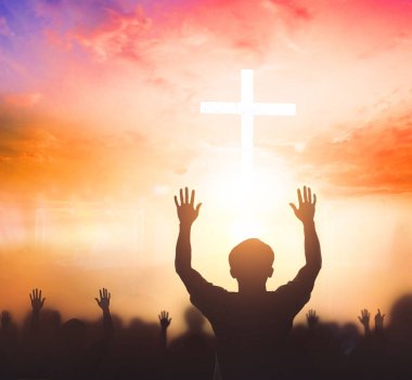Worship concept: christian people Raise hand over cross on spiritual sky background clipart