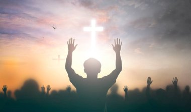 Worship concept: christian people Raise hand over cross on spiritual sky background clipart