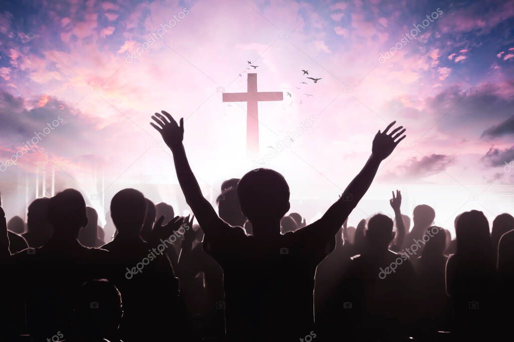 christian people group raise hands up worship God Jesus Christ together on cross over cloudy sky background