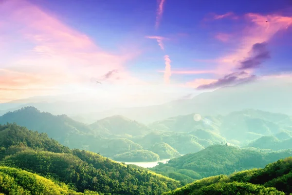World Environment Day concept: Amazing mountain landscape with colorful sunset on the cloudy sky