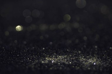 Bokeh glitter sinek ve siyah arka plan ışığı