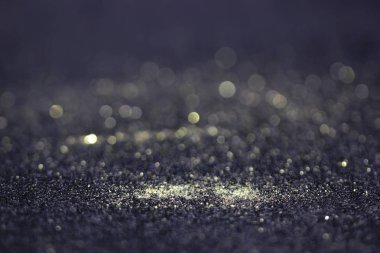 Bokeh glitter sinek ve siyah arka plan ışığı