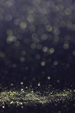 Bokeh glitter sinek ve siyah arka plan ışığı