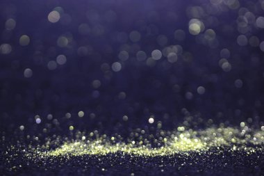 Bokeh glitter sinek ve siyah arka plan ışığı