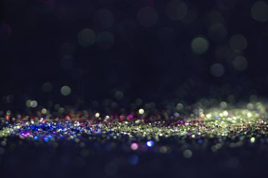 Bokeh glitter sinek ve siyah arka plan ışığı