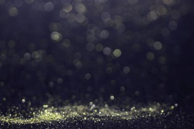 Bokeh glitter sinek ve siyah arka plan ışığı