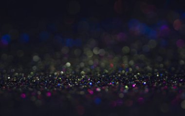 Bokeh glitter sinek ve siyah arka plan ışığı