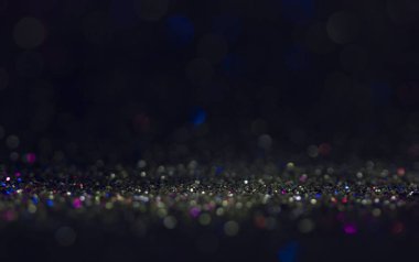 Bokeh glitter sinek ve siyah arka plan ışığı