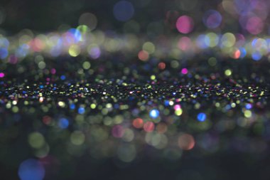 Bokeh glitter sinek ve siyah arka plan ışığı