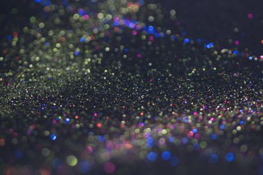 Bokeh glitter sinek ve siyah arka plan ışığı