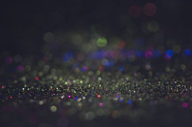 Bokeh glitter sinek ve siyah arka plan ışığı
