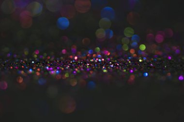 Bokeh glitter sinek ve siyah arka plan ışığı