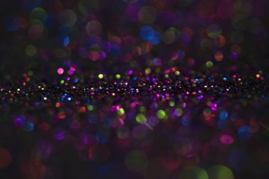 Bokeh glitter sinek ve siyah arka plan ışığı