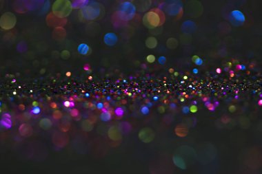 Bokeh glitter sinek ve siyah arka plan ışığı