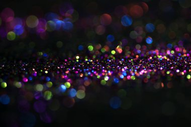 Bokeh glitter sinek ve siyah arka plan ışığı