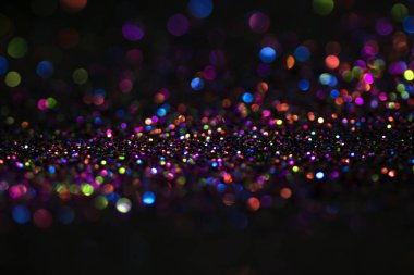 Bokeh glitter sinek ve siyah arka plan ışığı