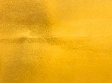 Parlak sarı yaprak altın folyo dokusu arka plan