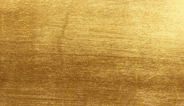 Shiny yellow leaf gold foil texture background