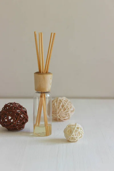 Aroma sticks in the bottle. aroma therapy objects. Aromatherapy reed diffuser air freshener horizontal.diffuser with wooden sticks. Copyspace for your text