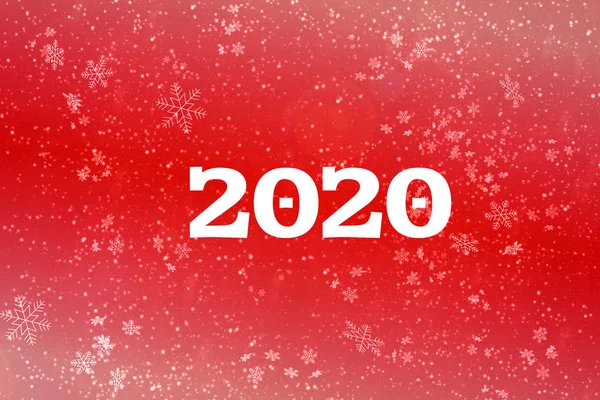 New year-2020. New year\'s composition, the concept of the New year. Inscription 2020 red background with painted snow and snowflakes. Illustration, copy space.