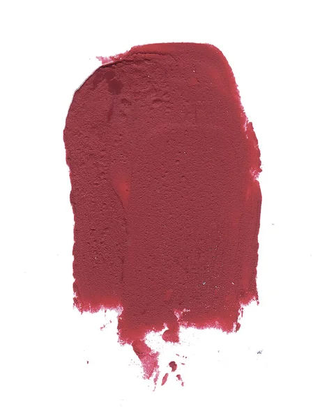 Red matte lipstick smear isolated on white background.