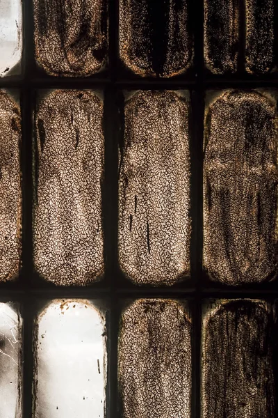 old stained glass window in the dust