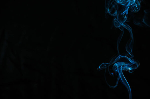 Smoke on a black background. Abstraction.