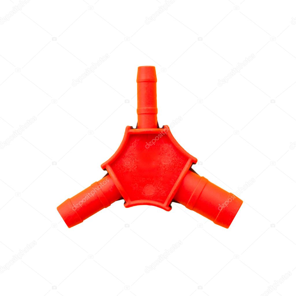 Red plastic calibrator of propylene pipes isolated on white background. A device for calibrating plastic pipes with three nozzles of different diameters. Isolate on white background.