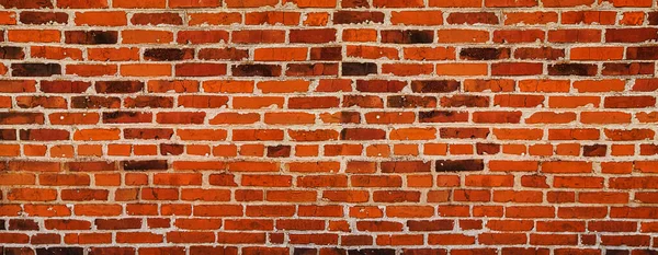 Brick wall of red color clinker bricks - wide panorama of masonry — Stock Photo, Image