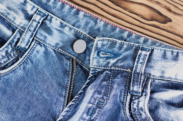 新しい青いジーンズの前面空のポケットとボタンなしのジッパー — ストック写真