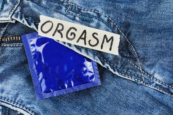 Inscripción Orgasm Papel Desgarrado Condón Paquete Azul Lámina Nuevos Pantalones —  Fotos de Stock