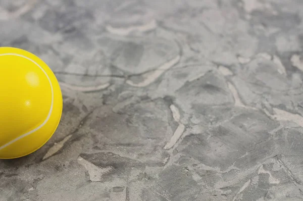 One New Yellow Soft Rubber Tennis Ball Old Worn Cement — Stock Photo, Image