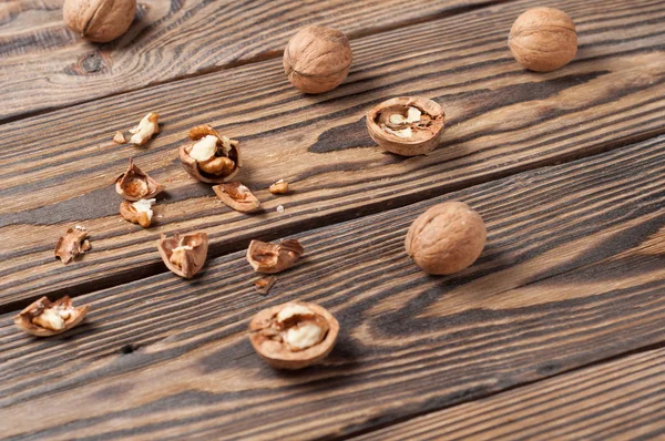 Lot Raw Walnuts Whole Broken Strewn Old Weathered Wooden Table — Stock Photo, Image