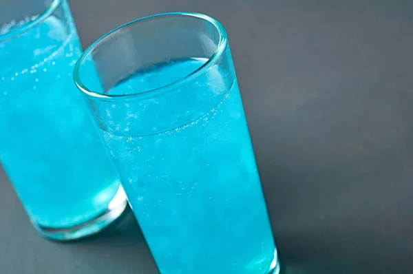 Full Glasses Cocktail Blue Color Ice Lies Dark Scratched Concrete — Stock Photo, Image