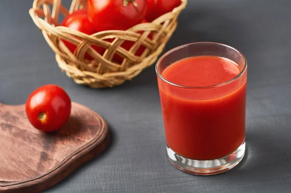 Full Glass Fresh Juice Wiker Wooden Basket Full Ripe Tomatoes — Stock Photo, Image