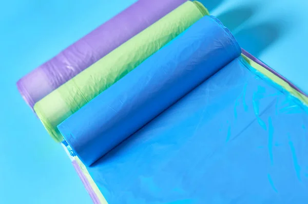 Row Rolls Disposable Plastic Garbage Bag Blue Background Close — Stock Photo, Image