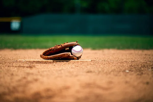 baseball glove on pitcher mound