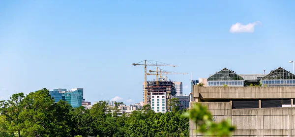 Building with crane on top in construction