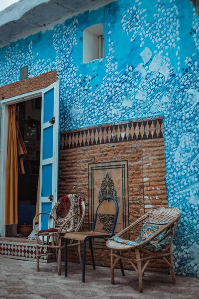 view of house in white and blue colors at old quarter in city Assilah, Morocco