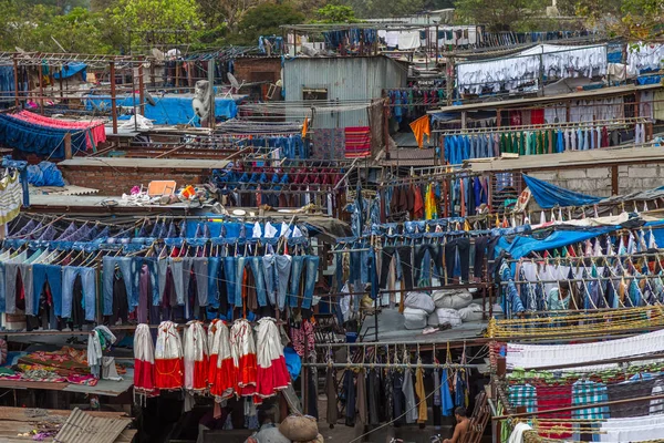 Dhobi Ghat is a well known open air laundromat in Mumbai, India. The washers, known as dhobis, work in the open to clean clothes and linens from Mumbai\'s hotels and hospitals.