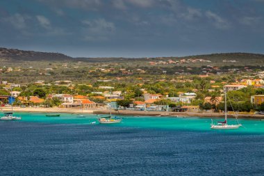 Welcome to Bonaire, Divers Paradise. Arriving at Bonaire, capture from Ship at the Capital of Bonaire, Kralendijk in this beautiful island of the Caribbean Netherlands, with its paradisiac beaches and water. clipart