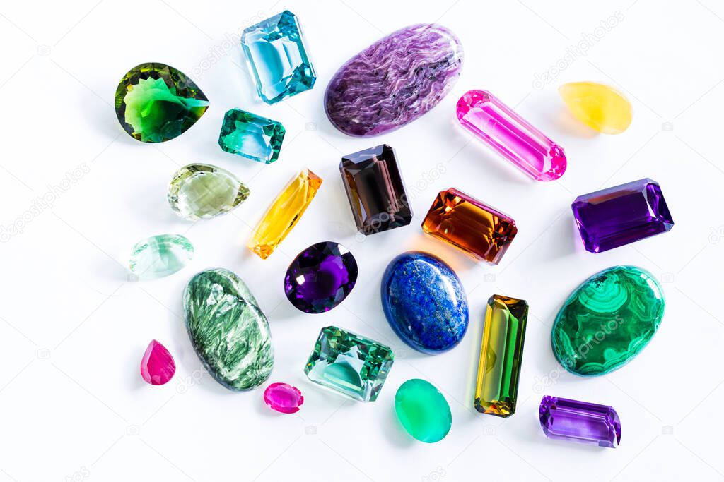 close up on various faceted gems, white background