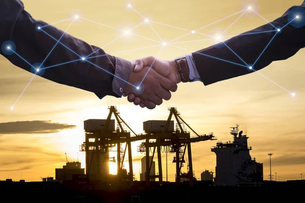 Business collaboration and cooperation agreement with data network communications : silhouette industrial shipping port and sunrise, transportation import export with business hands