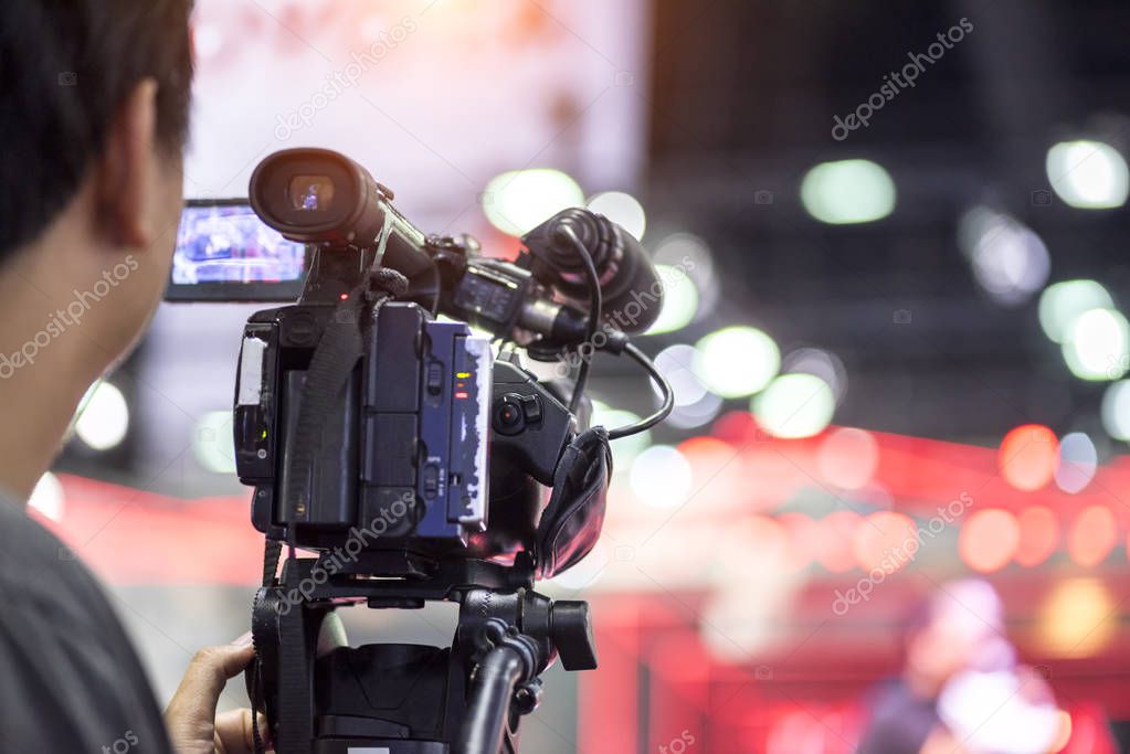 Professional video technician.Videographer working in the event. On air live