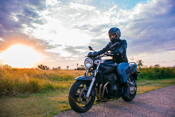 Man Sitting Black Motorcycle Wearing Jeans Black Jacket Black Helmet — Stock Photo, Image