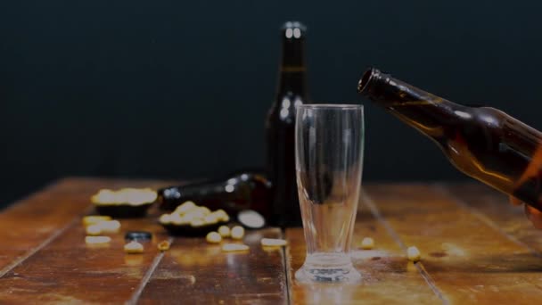 Scene Wooden Table Salty Snacks Some Glass Bottles Beer Foreground — Stock Video