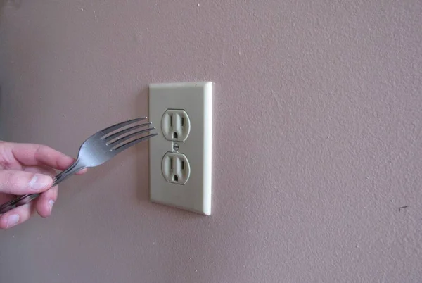 Person Putting Fork Electrical Outlet Wall — Stock Photo, Image