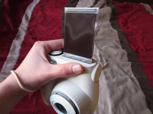 Person Holding Instant Camera Photo Printing Out — Stock Photo, Image