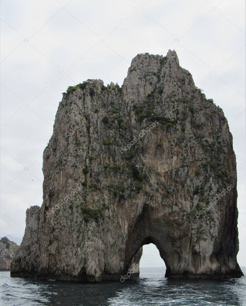 View of the Faraglioni, which are famous rock formations off the coast of Capri, Italy